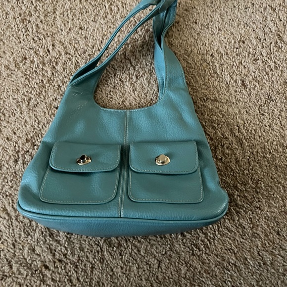 Turquoise colored shoulder bag. Has separate inside compartments. 13” X 9”. - Picture 1 of 5